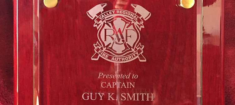 Fire Captain Guy Smith receives award